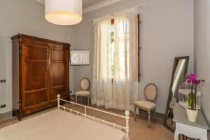 Postel nebo postele na pokoji v ubytování Villa Ricci Suites