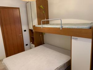 Postel nebo postele na pokoji v ubytování Torre Lapillo