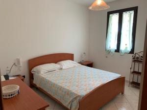 Postel nebo postele na pokoji v ubytování Torre Lapillo