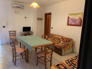 TV a/nebo společenská místnost v ubytování Torre Lapillo + 3 fotografie