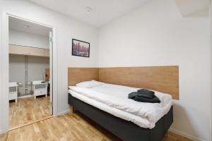 a bedroom with a large bed in a room at Chefens Hotell in Södertälje