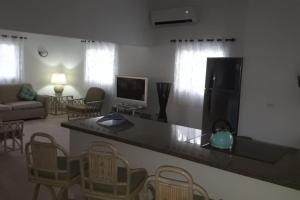 a living room with a counter top and a living room at Luna 39 in Oranjestad