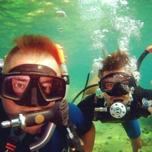 two people wearing snorkelling equipment in the water at Sunset Old Town in Ulcinj