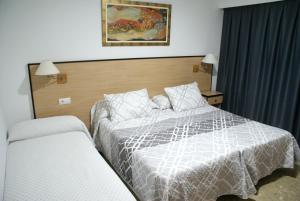 Postel nebo postele na pokoji v ubytování Hotel Carabela 2