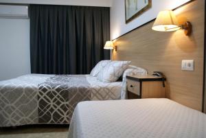 Postel nebo postele na pokoji v ubytování Hotel Carabela 2