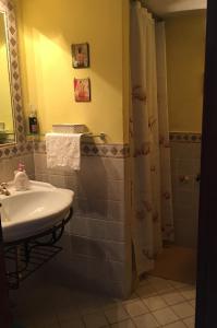 a bathroom with a sink and a shower at Maison Violet by Breathe Liguria in Portovenere