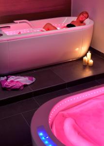 Voodi või voodid majutusasutuse Aqualux Hotel Spa Suite & Terme toas