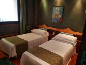 Postel nebo postele na pokoji v ubytování HR Hotel