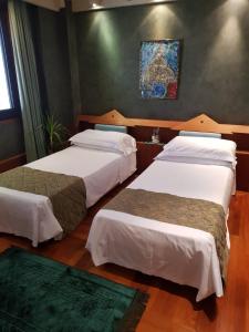 Postel nebo postele na pokoji v ubytování HR Hotel