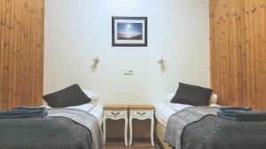 Postel nebo postele na pokoji v ubytování Guesthouse Skálafell