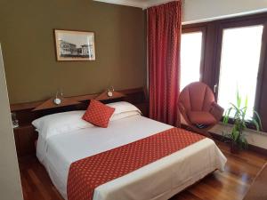 Postel nebo postele na pokoji v ubytování HR Hotel