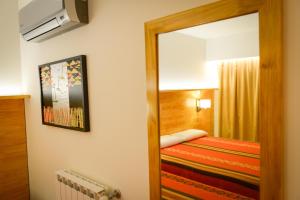 a room with a door leading to a bedroom at Amérian Villa del Dique in Villa del Dique