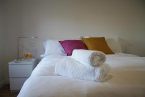 Un pat sau paturi într-o cameră la Apartamento Plaza de Toros