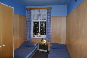 Posteľ alebo postele v izbe v ubytovaní Hostel Fortuna