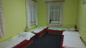 Posteľ alebo postele v izbe v ubytovaní Hostel Fortuna