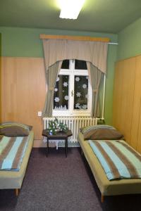 Posteľ alebo postele v izbe v ubytovaní Hostel Fortuna