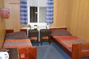 Posteľ alebo postele v izbe v ubytovaní Hostel Fortuna