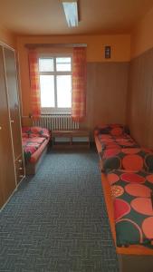 Posteľ alebo postele v izbe v ubytovaní Hostel Fortuna