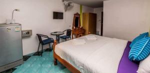 Ένα ή περισσότερα κρεβάτια σε δωμάτιο στο Nong Guest House