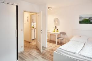 Cama o camas de una habitación en Apartments 4 YOU - Lange Straße