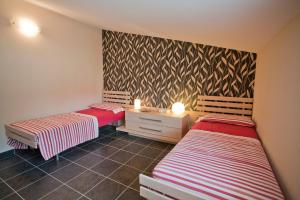 En eller flere senge i et værelse på Luxury Villa Marina di Ragusa