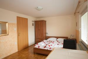 Postel nebo postele na pokoji v ubytování Guest House Čelan