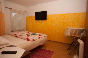 Postel nebo postele na pokoji v ubytování Guest House Čelan
