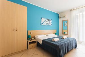 Postel nebo postele na pokoji v ubytování Hotel Baia Del Sole