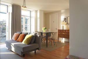a living room with a couch and a table at Porto View by Patio 25 in Vila Nova de Gaia