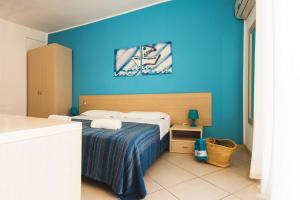 Postel nebo postele na pokoji v ubytování Hotel Baia Del Sole