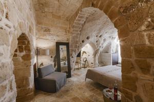 Postel nebo postele na pokoji v ubytování Cenobio Hotel & SPA Matera