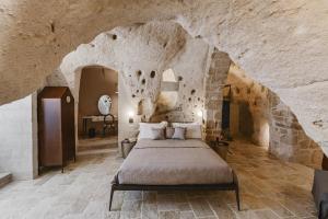 Postel nebo postele na pokoji v ubytování Cenobio Hotel & SPA Matera