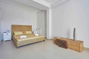 a bedroom with a bed and a table in a room at Villa Biancolilla in Castellammare del Golfo