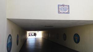 a hallway in a building with a sign on the wall at Beach House Cascais in Estoril
