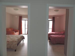 Postel nebo postele na pokoji v ubytování Antros, Apartment 1