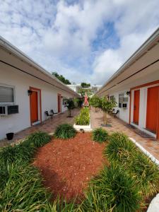 a courtyard of a house with a garden at Royal Budget Inn in Miami