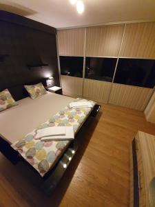 A bed or beds in a room at Apartman Marković