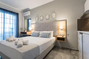 A bed or beds in a room at Georgioupolis Beach Hotel
