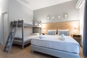 A bed or beds in a room at Georgioupolis Beach Hotel