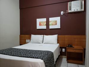Una cama o camas en una habitación de Hotel Costa Victória