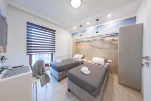 Posteľ alebo postele v izbe v ubytovaní Granary Island Apartment II