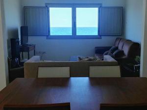 a living room with a couch and a table at La Casa del Mar in Garachico
