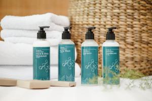 a group of three shampoo bottles sitting on a counter at Anja Jimbaran in Jimbaran