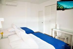Postel nebo postele na pokoji v ubytování Hotel Gran Palma Piura