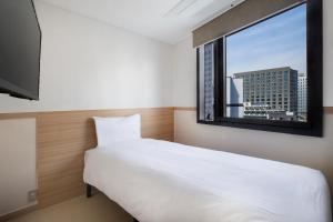 Säng eller sängar i ett rum på Five hotel Jongno