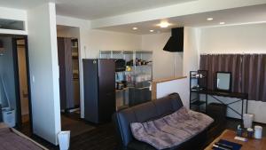 a living room with a couch and a table at VACANCE club in Ishigaki Island