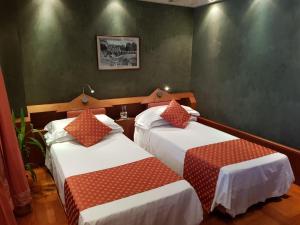 Postel nebo postele na pokoji v ubytování HR Hotel