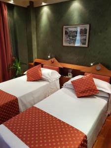 Postel nebo postele na pokoji v ubytování HR Hotel