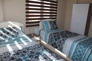 Postel nebo postele na pokoji v ubytování Rahal Kalkınma Apart