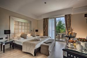 Posteľ alebo postele v izbe v ubytovaní Park Hotel Junior